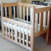 Child’s cot in ash